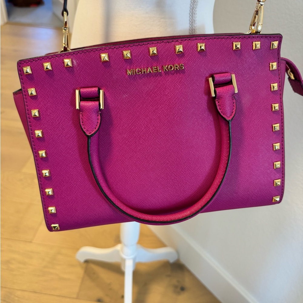 Michael Kors magenta purse handbag with Crossbody strap.